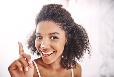 Buy stock photo Happy woman, portrait or nose with lotion for skincare, beauty or grooming in bathroom at home. Young, female person or smile with cream or moisturizer for soft skin, touch or facial hygiene at house