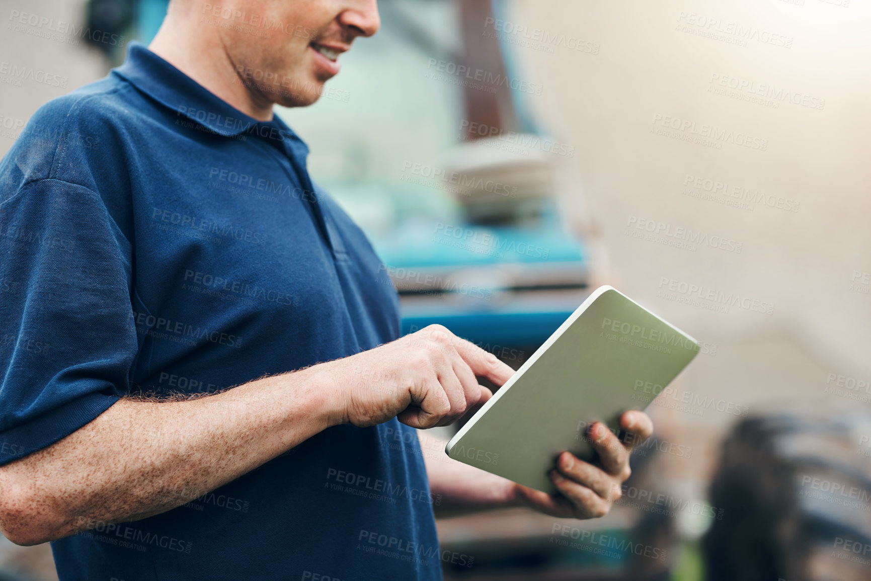 Buy stock photo Farmer, man and hand with tablet by tractor for agriculture, website and research on industry. Farming, planning and male person with technology for production, information and reading weather update