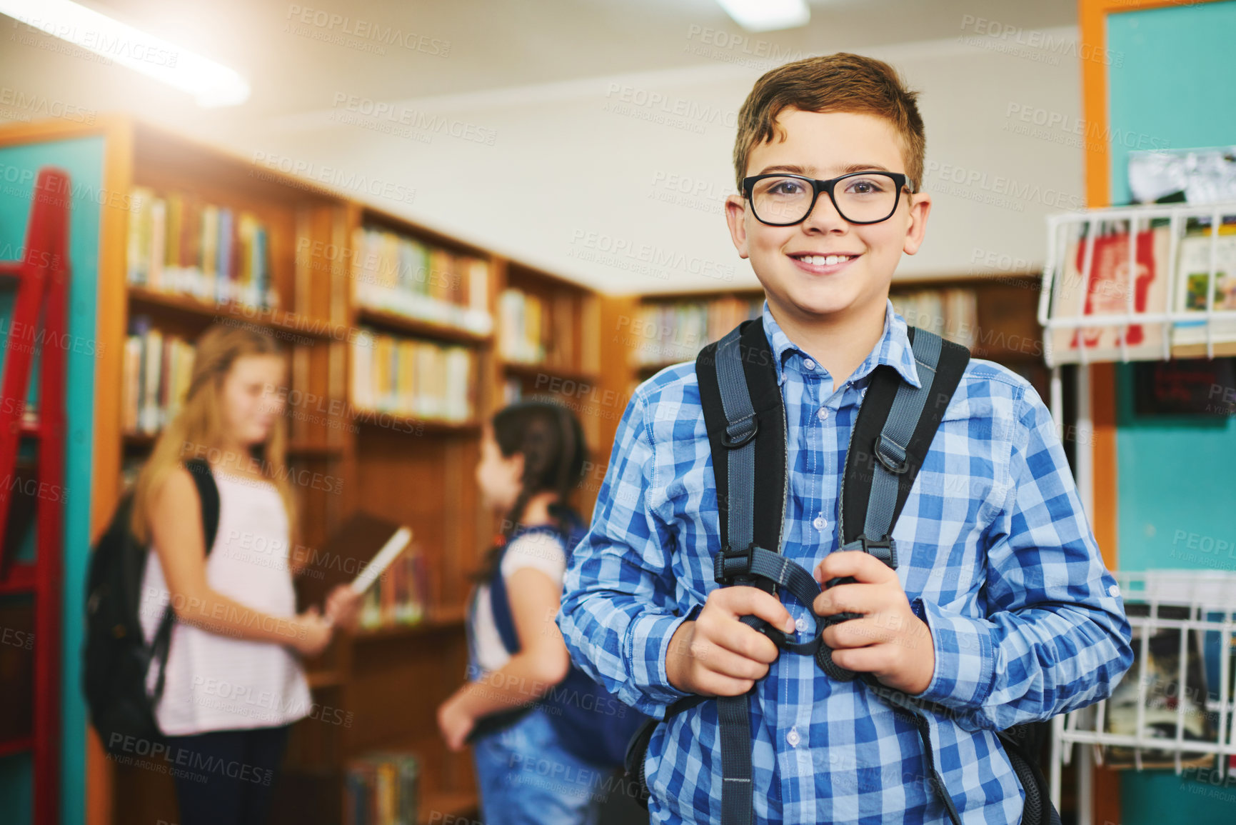 Buy stock photo Library, backpack and portrait of happy child in school with glasses for vision or learning. Smile, face and young kid student with growth, development and education at academy for knowledge or study