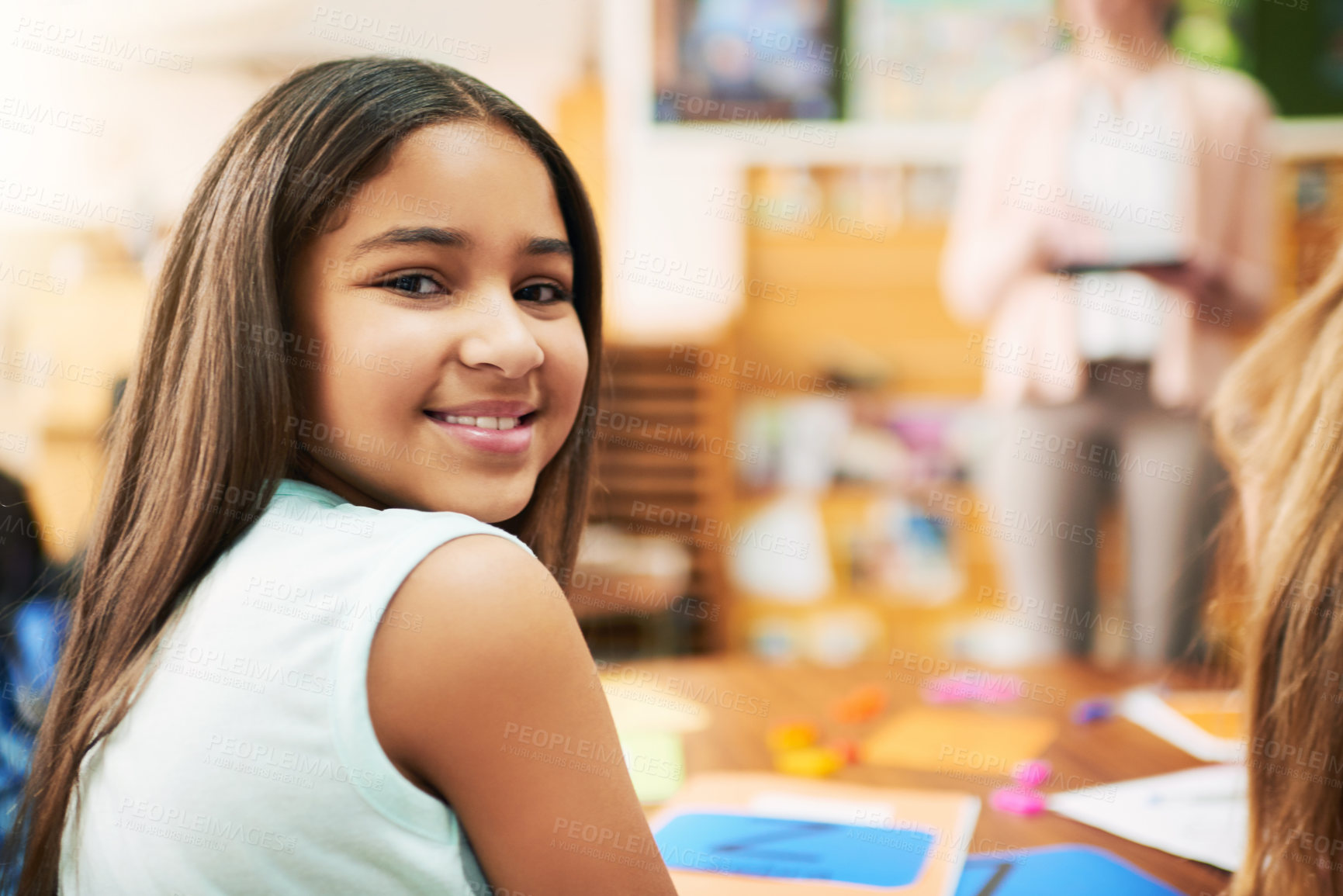 Buy stock photo Girl, child and portrait in classroom with books, happy and lesson for education, development and progress. Kid, smile and excited for notes, language and scholarship for study at school in Mexico