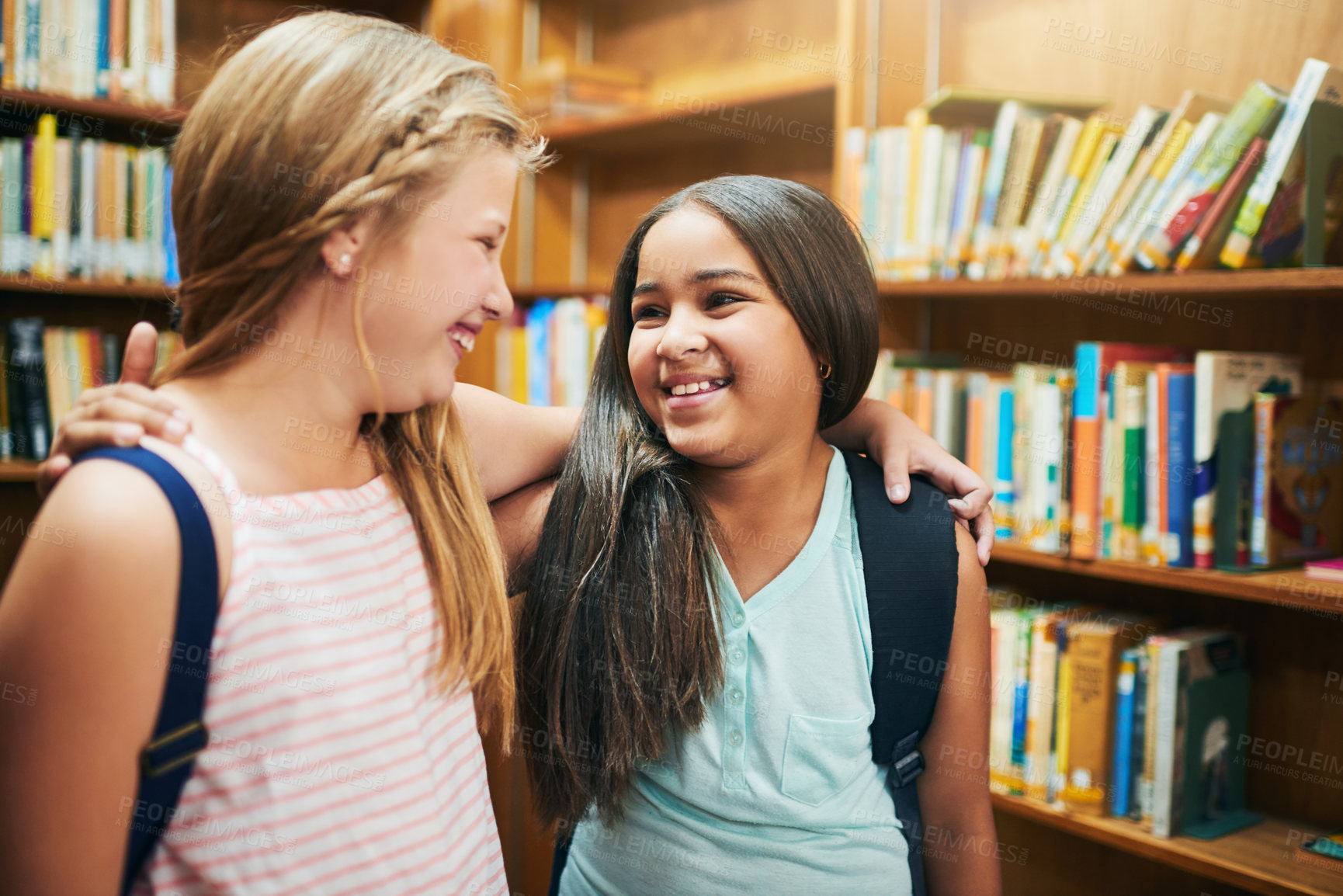 Buy stock photo Bookshelf, happy kids or students hug in library for education, development and learning in junior grade together. Learners, primary school and children with smile, support and proud girl friends