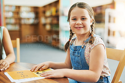 Buy stock photo Student, happy and portrait in library for learning, education and study with childhood development. Girl, papers and excited in school for math knowledge, reading and academic information with smile