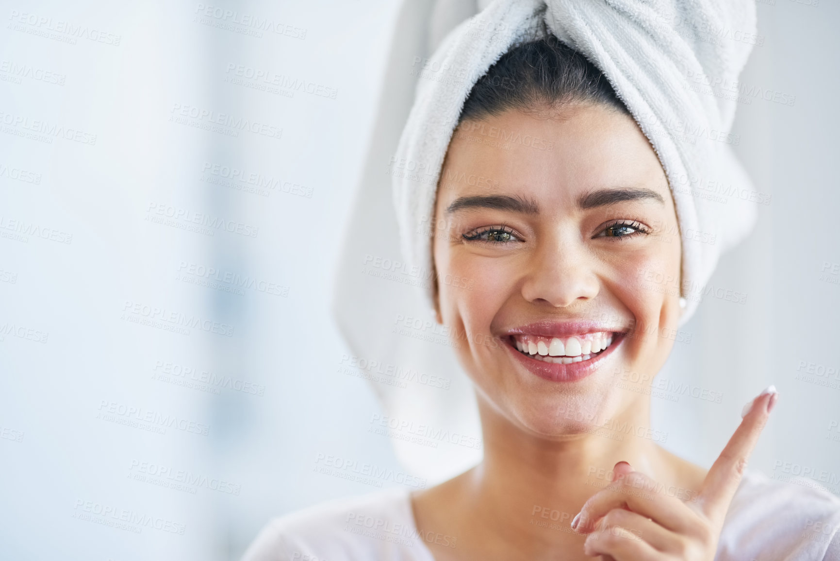 Buy stock photo Beauty, lotion and portrait of excited woman in bathroom of home for morning skincare routine. Cream, finger and smile with happy person in towel at apartment for antiaging cosmetics or dermatology