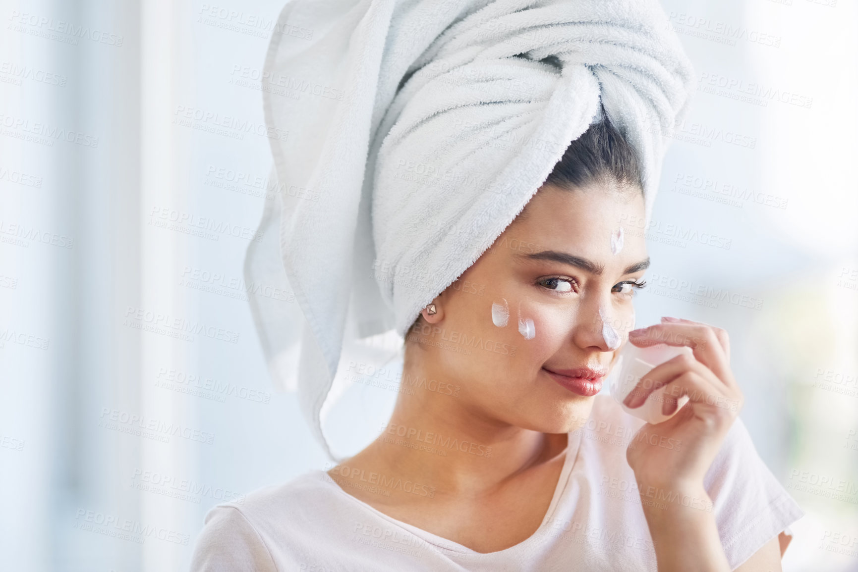 Buy stock photo Beauty, moisturizer and portrait with woman in bathroom of home for morning skincare routine. Cream, finger and nose with face of person in towel at apartment for antiaging cosmetics or dermatology