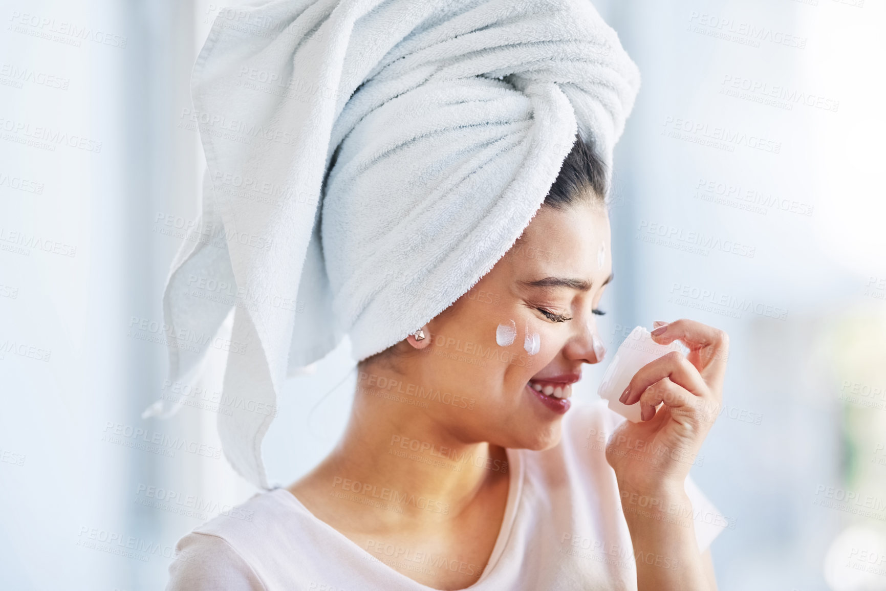 Buy stock photo Beauty, moisturizer and smell with face of woman in bathroom of home for morning skincare routine. Cream, scent and smile of happy person with product in apartment for cosmetics or dermatology