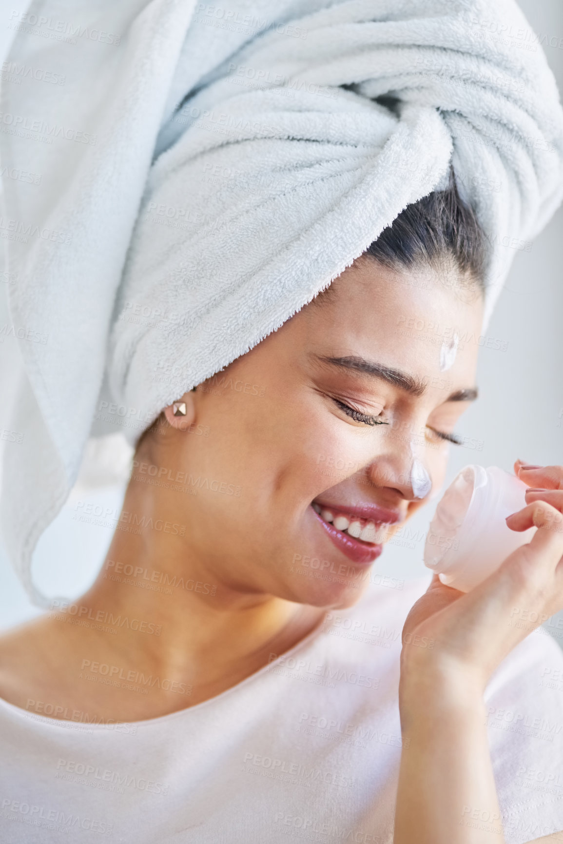 Buy stock photo Beauty, moisturizer and scent with face of woman in bathroom of home for morning skincare routine. Cream, smell and smile of happy person with product in apartment for cosmetics or dermatology