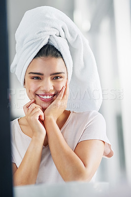 Buy stock photo Portrait, skincare and smile of woman, mirror and proud with shine, soft and grooming for wellness. Bathroom, confident and reflection of person, happy and treatment of dermatology, towel and home