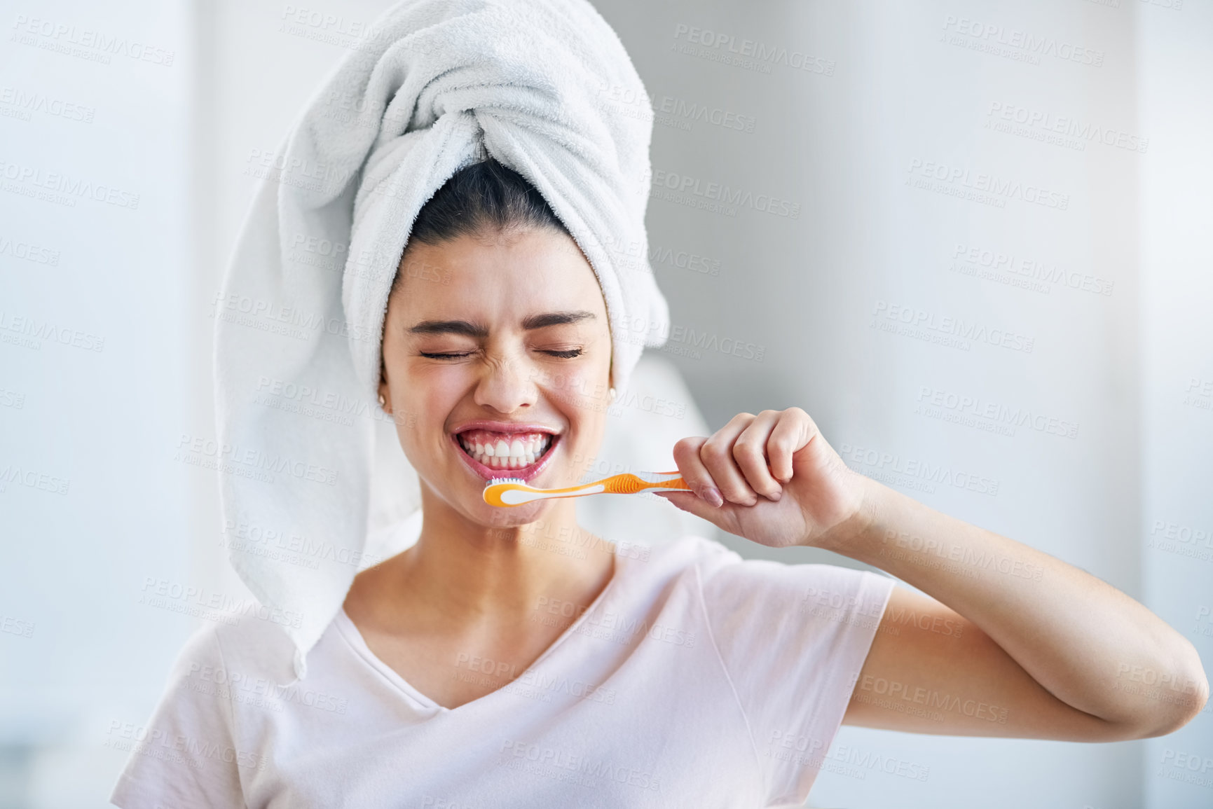 Buy stock photo Woman, smile and mouth with brushing teeth in bathroom for oral hygiene, fresh breath and gum health. Towel, happy and person with toothbrush for dental care, cleaning and morning routine at home