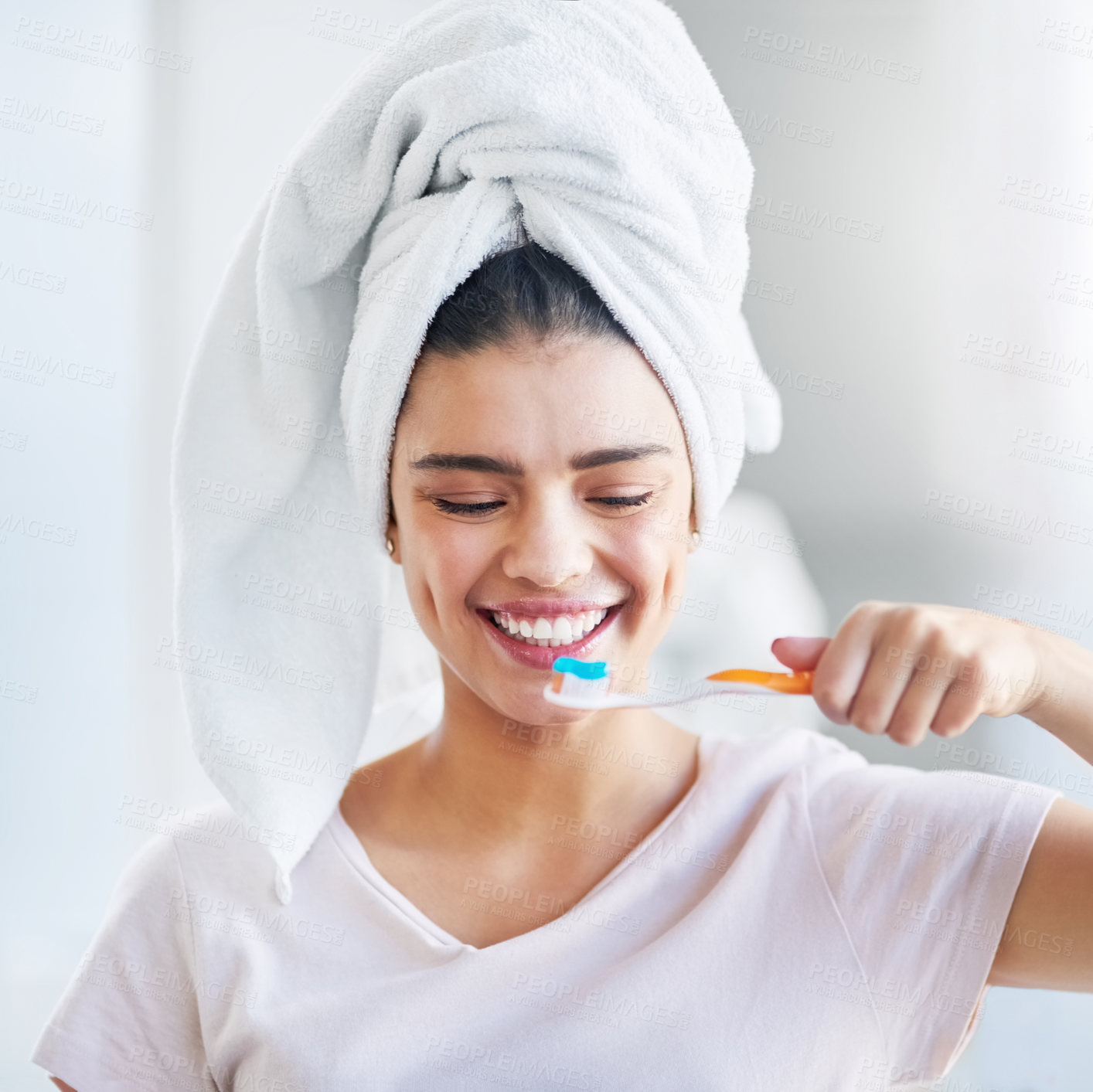 Buy stock photo Happy, woman and toothpaste with brushing teeth in bathroom for oral hygiene, health and cleaning. Toothbrush, towel and person with smile for fresh breath, dental care and morning routine at home