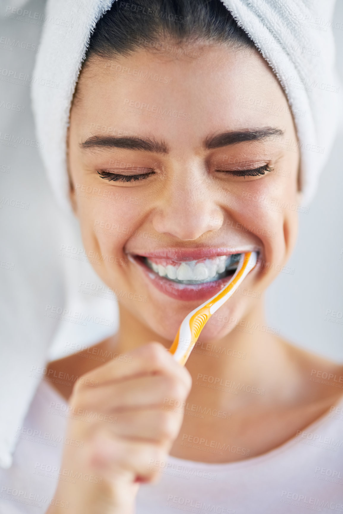 Buy stock photo Woman, towel and happy with brushing teeth in home for oral hygiene, cleaning or plaque removal. Toothbrush, smile and person with satisfaction for fresh breath, health or morning routine in bathroom