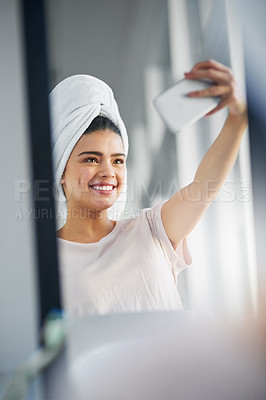 Buy stock photo Woman, happy and reflection with selfie in bathroom for skincare, routine and social media update. Cosmetics, influencer and towel with digital photography in home for online, dermatology and post