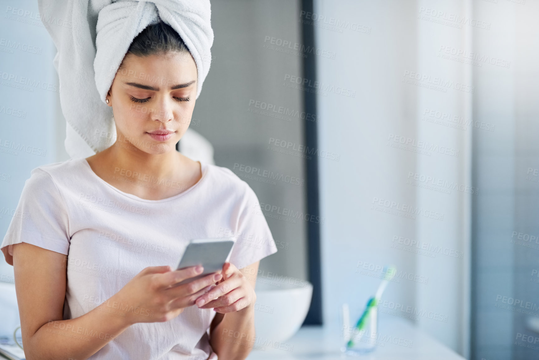 Buy stock photo Woman, towel and skincare with phone in bathroom for beauty treatment, update or research on facial. Morning,  routine and person with tech at home for website, connection or online dermatology tips