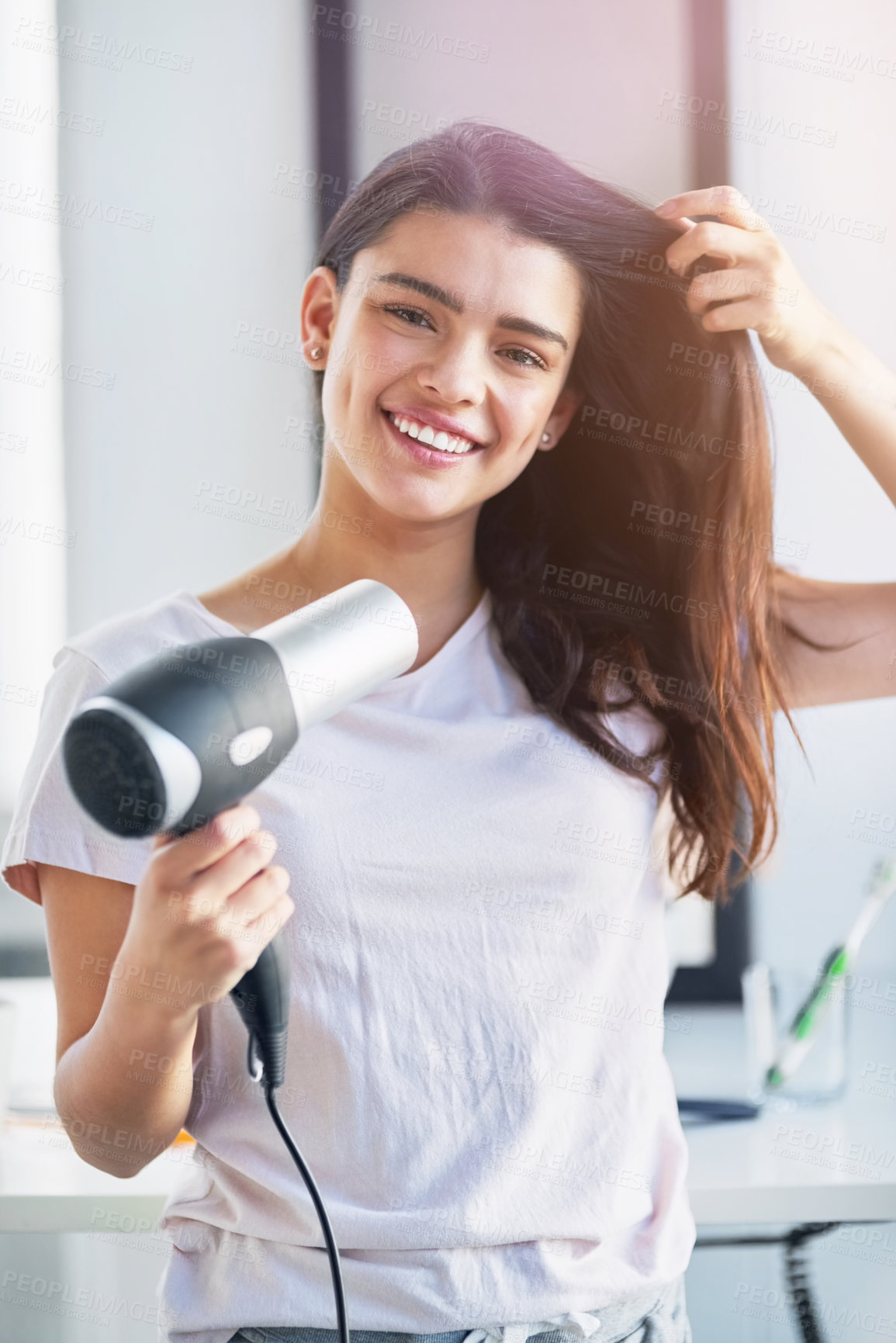 Buy stock photo Woman, portrait and hair dryer in home, grooming and morning for getting ready in bathroom. Female person, cosmetics tool and appliance for hairstyle, Indonesia and heat treatment for healthy texture