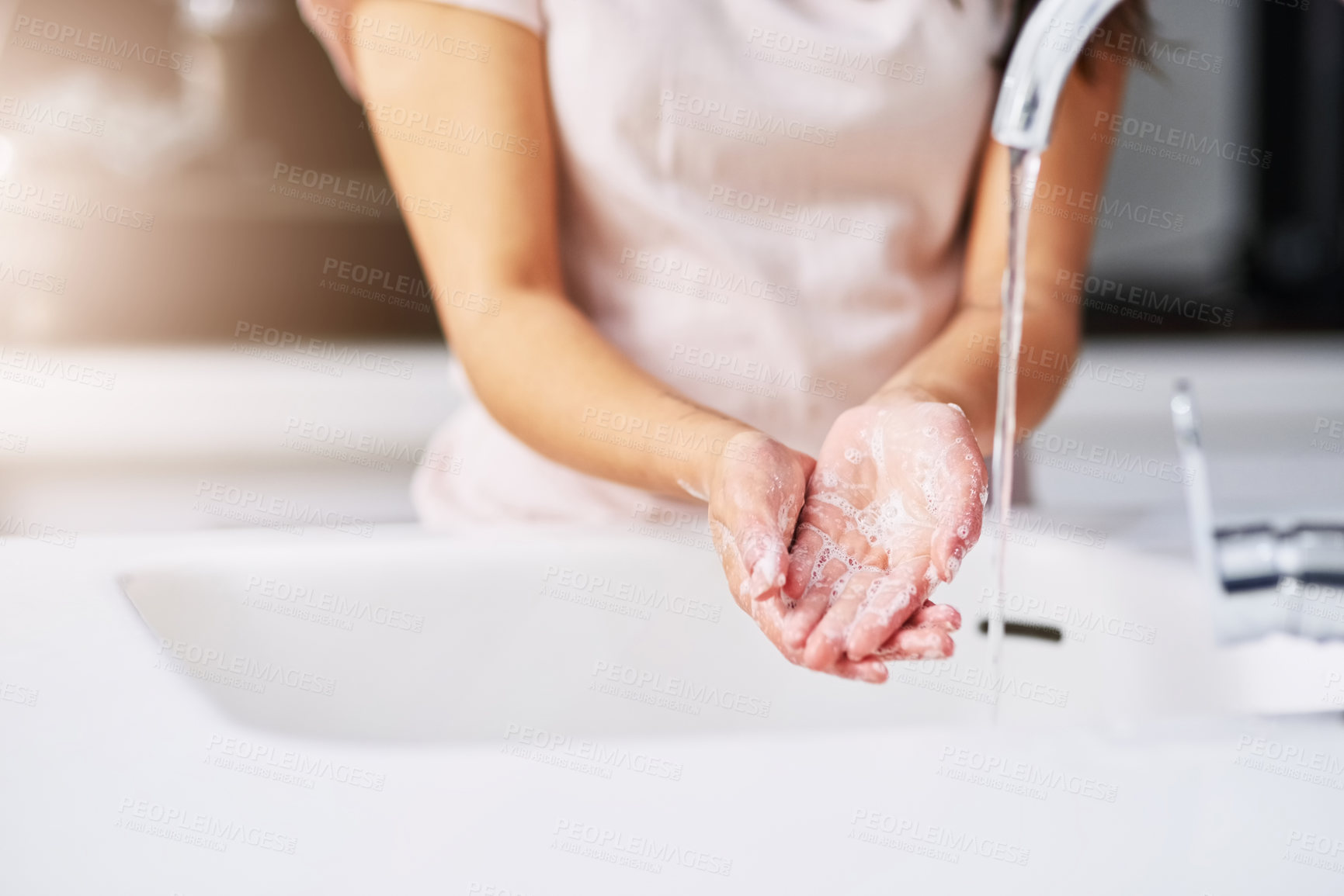 Buy stock photo Closeup shot of an unrecognizable woman washing her hands