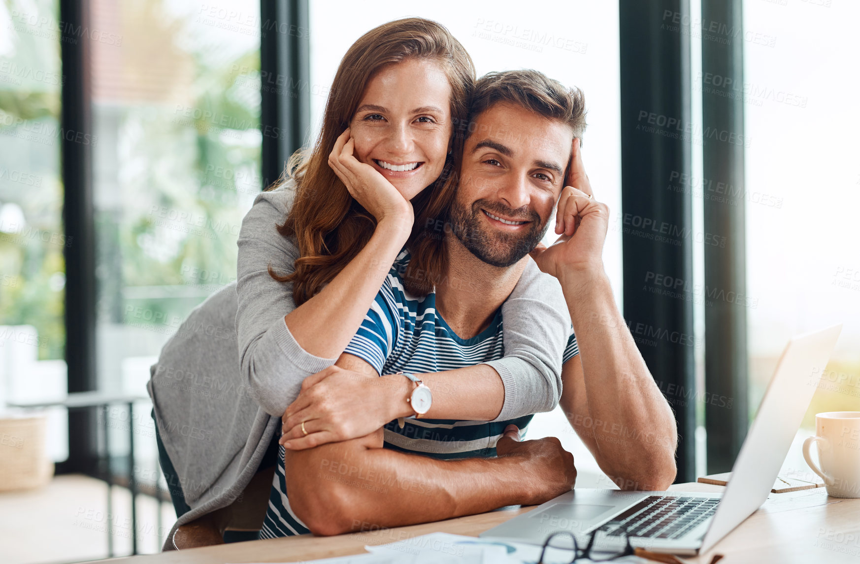 Buy stock photo Portrait, happy couple and hug by laptop in home office for finance, planning or budget. Man, woman and embrace by computer for remote work of freelancer for savings, investment or asset management