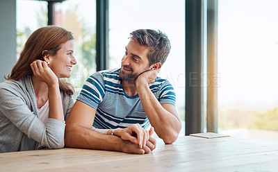 Buy stock photo Conversation, couple and holding hands in home for marriage, together and morning in living room. Love, support and man with woman for chat, care and security or discussion in house or apartment