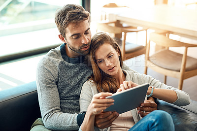 Buy stock photo Hug, couple and tablet on sofa for web app, movie selection or streaming choice at home. Thinking, man and woman with tech and love embrace on couch for bonding, search and scrolling tv subscription