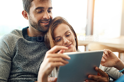 Buy stock photo Happy, couple and hug with tablet and web app subscription for streaming, movie selection or tv choice. Smile, man and woman with tech and love embrace on couch for bonding, search and scroll at home