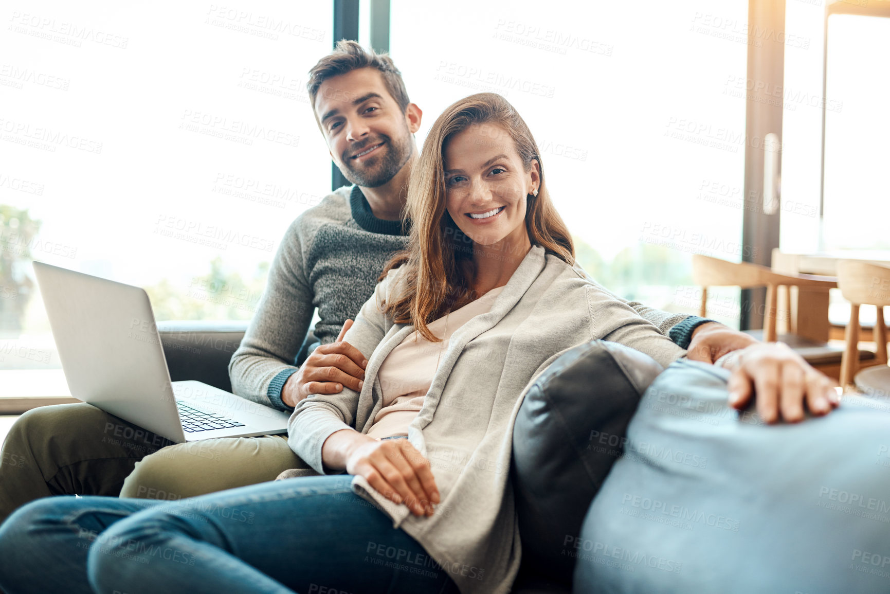 Buy stock photo Portrait, smile and couple on laptop in home for relax, support and connection for love together. Happy man, woman and computer on sofa for social media, news and streaming on website in living room