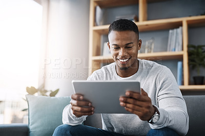 Buy stock photo Relax, tablet and happy man on sofa reading social media meme, email or streaming video on subscription service. Happiness, internet and connection, male with smile on face and movie website on couch