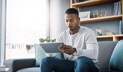 Buy stock photo Relax, tablet and man on sofa, internet scroll and reading social media post, email or streaming video on subscription. Mobile app, info and online connection, person surfing movie website on couch.