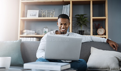 Buy stock photo Man, smile and laptop in home on couch, networking and social media for online streaming in living room. Happy, research and technology website, remote work or internet blog or elearning in apartment