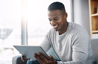 Buy stock photo Smile, tablet and happy man on couch reading social media meme, email or streaming video on subscription service. Happiness, internet and networking, person on sofa checking online movie website.