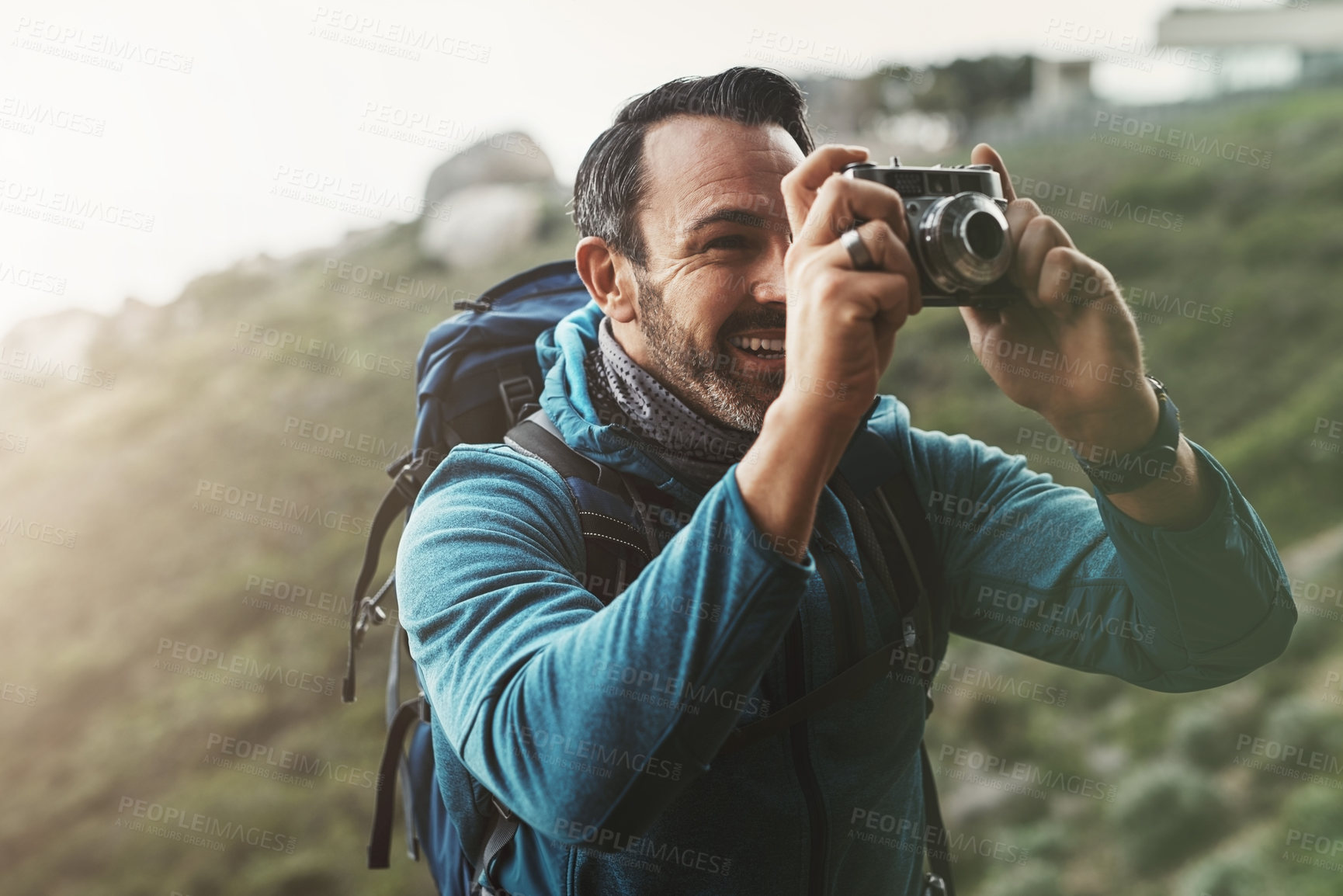 Buy stock photo Forest, photography and happy man with camera in nature for travel, hiking or journey memory. Jungle, backpack and mature wildlife photographer with digital lens for adventure, explore or discovery
