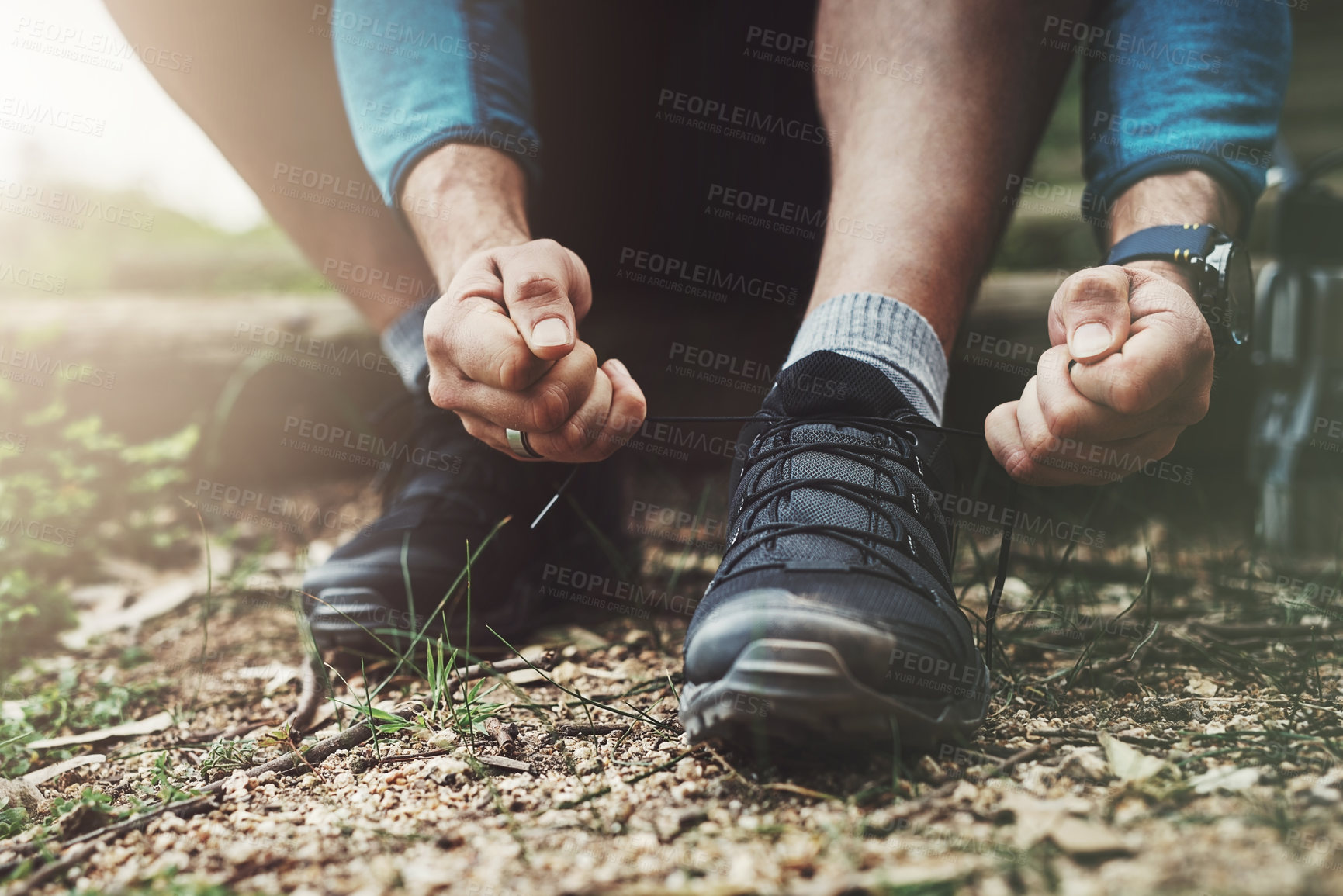 Buy stock photo Tying laces, hiking and hands in nature to start walking, adventure or trekking for exercise. Shoes, sports and feet of a man getting ready for cardio, training or a walk for fitness in a park