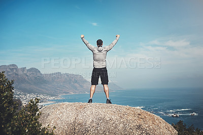 Buy stock photo Back, hike and man with nature, celebration and travel with blue sky, achievement of rock. Rear view, person or hiker with environment, freedom or ocean with summer, explore or journey with adventure