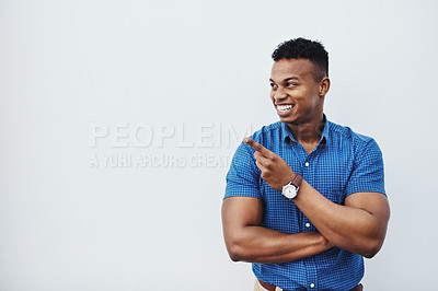 Buy stock photo Business, mockup and African man with hand pointing to studio for news, announcement or recruitment info on white background. Contact us, presentation or entrepreneur show space for sign up promo