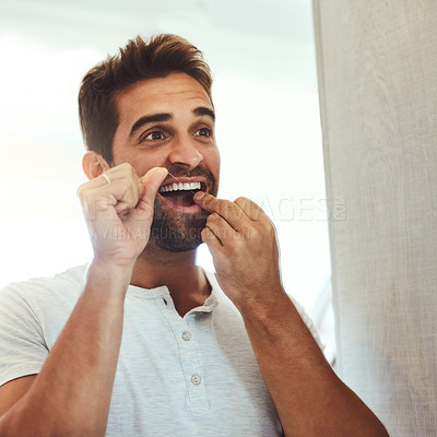 Buy stock photo Dental floss, morning and teeth with man in bathroom mirror for cleaning, habit and oral hygiene. Smile, cosmetics and health with male person flossing at home for self care, breath and mouth 
