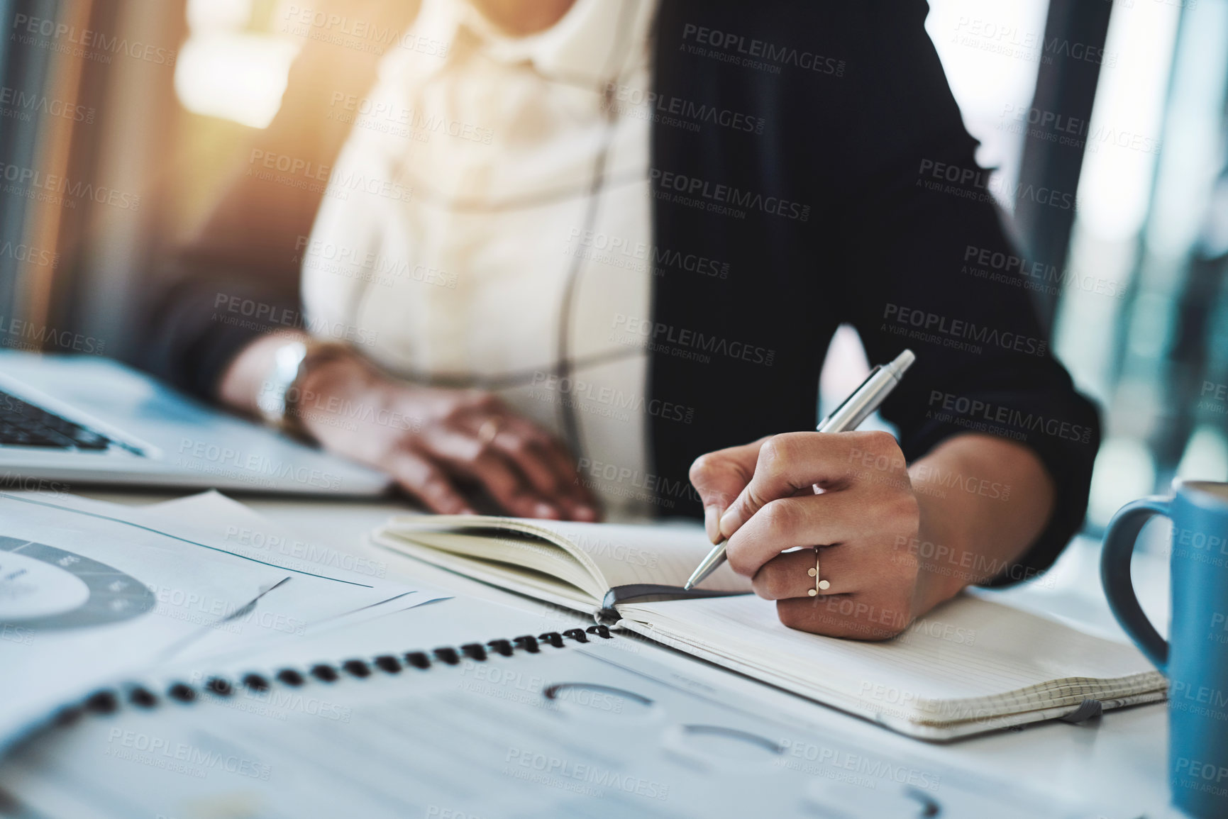 Buy stock photo Business woman, hands and writing in a office with planning notes and corporate notebook. Female person, employee and work planner book with company paperwork and charts for professional project