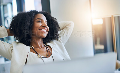 Buy stock photo Shot of a young businesswoman laying back and relaxing at her office desk