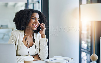 Buy stock photo Shot of a young businesswoman taking a phone call at her office desk