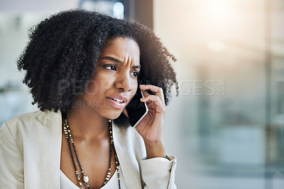 Buy stock photo Shot of a young businesswoman making a phone call in her office