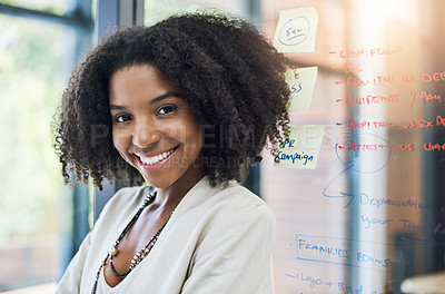 Buy stock photo Portrait of a young businesswoman smiling and in good spirits in her office