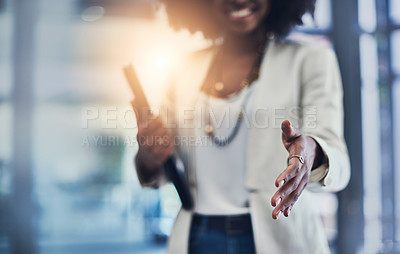 Buy stock photo Shot of an unrecognizable businesswoman reaching out for a handshake