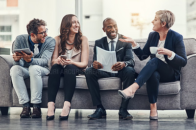 Buy stock photo Full length shot of a group of businesspeople brainstorming together in an office