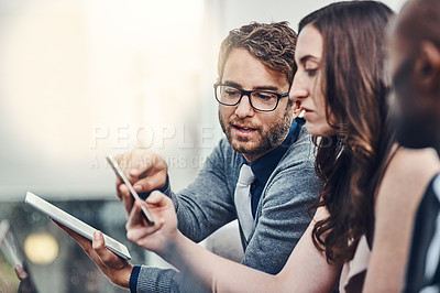 Buy stock photo Cropped shot of a group of businesspeople brainstorming together in an office