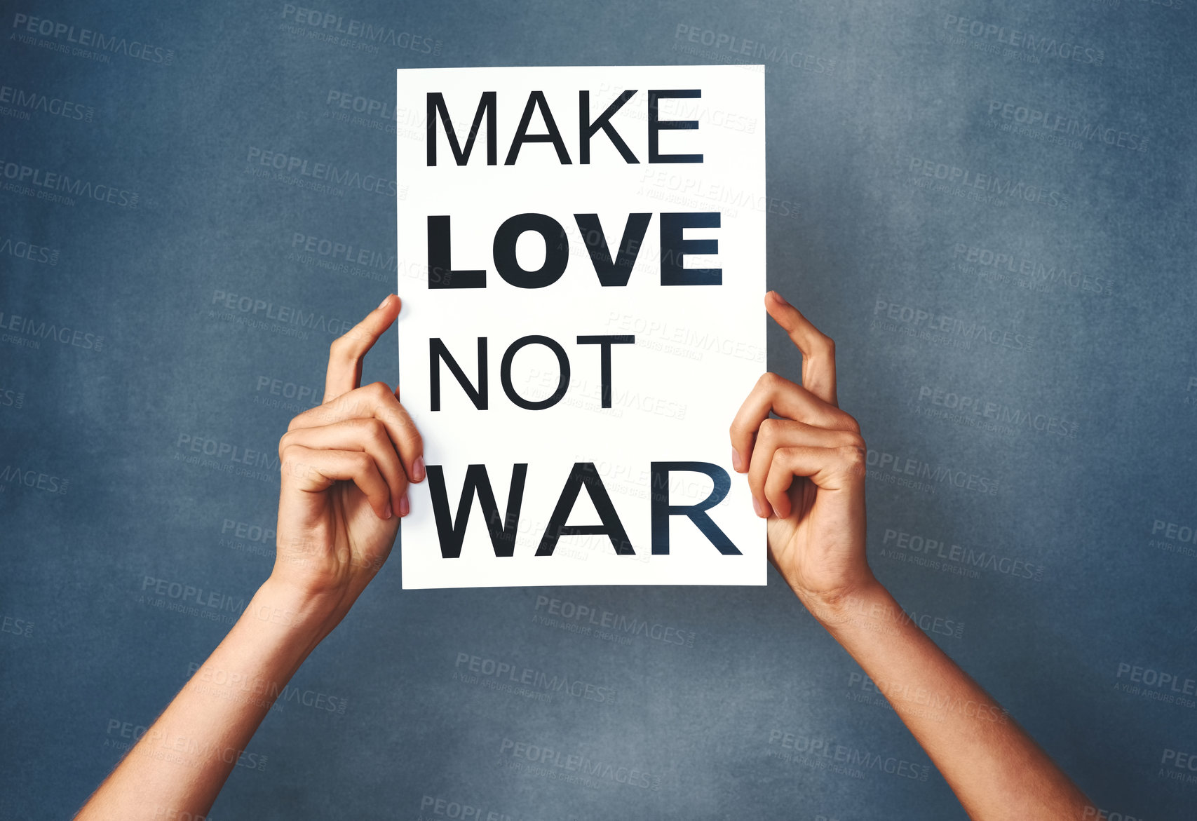 Buy stock photo Hands, person and poster in studio for rally, paper and promote peace or bulletin for information. Activist, voice and placard for social crisis or conflict, cardboard and slogan on blue background