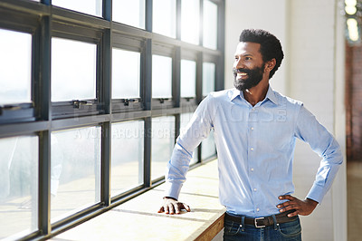 Buy stock photo Window, idea and smile with a business man in the office to focus on company growth or success. Happy, vision and thinking with a male employee standing hand on hip in the workplace during his break