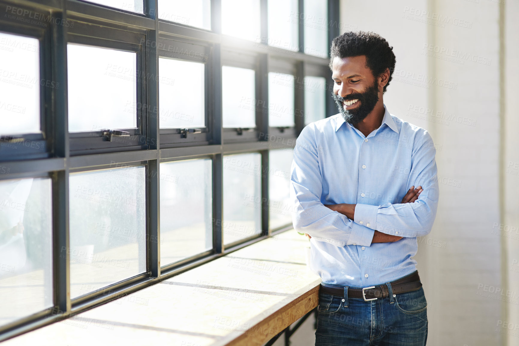 Buy stock photo Window, lens flare and a business man arms crossed in the office with a smile or mindset of future success. Happy, vision and thinking with a male employee standing in the workplace during his break