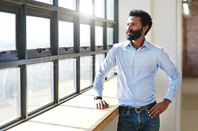 Buy stock photo Window, flare and thinking with a business in the office to focus on future success or company vision. Idea, mindset and corporate with a male employee standing in the workplace during his break