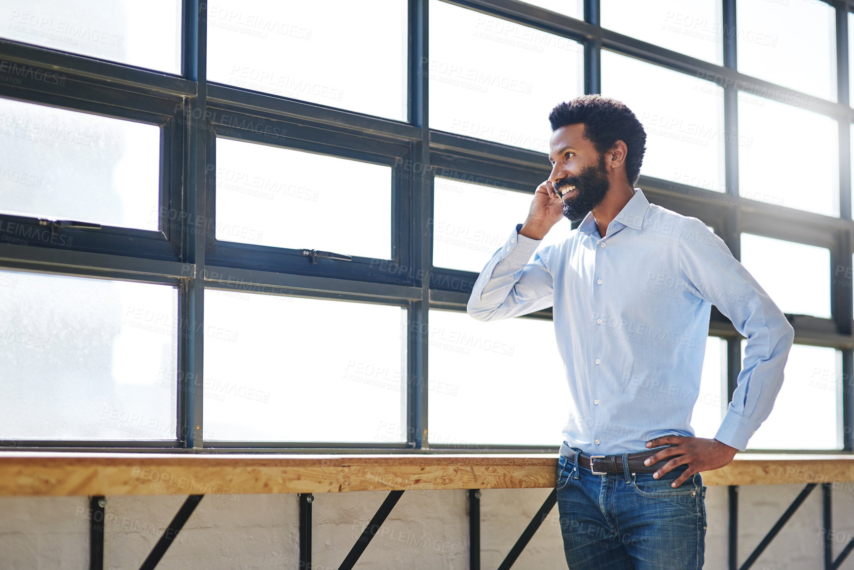 Buy stock photo Window, phone call and a happy business man thinking in the office with a smile or mindset of future success. Idea, vision and communication with a male employee talking at work during his break