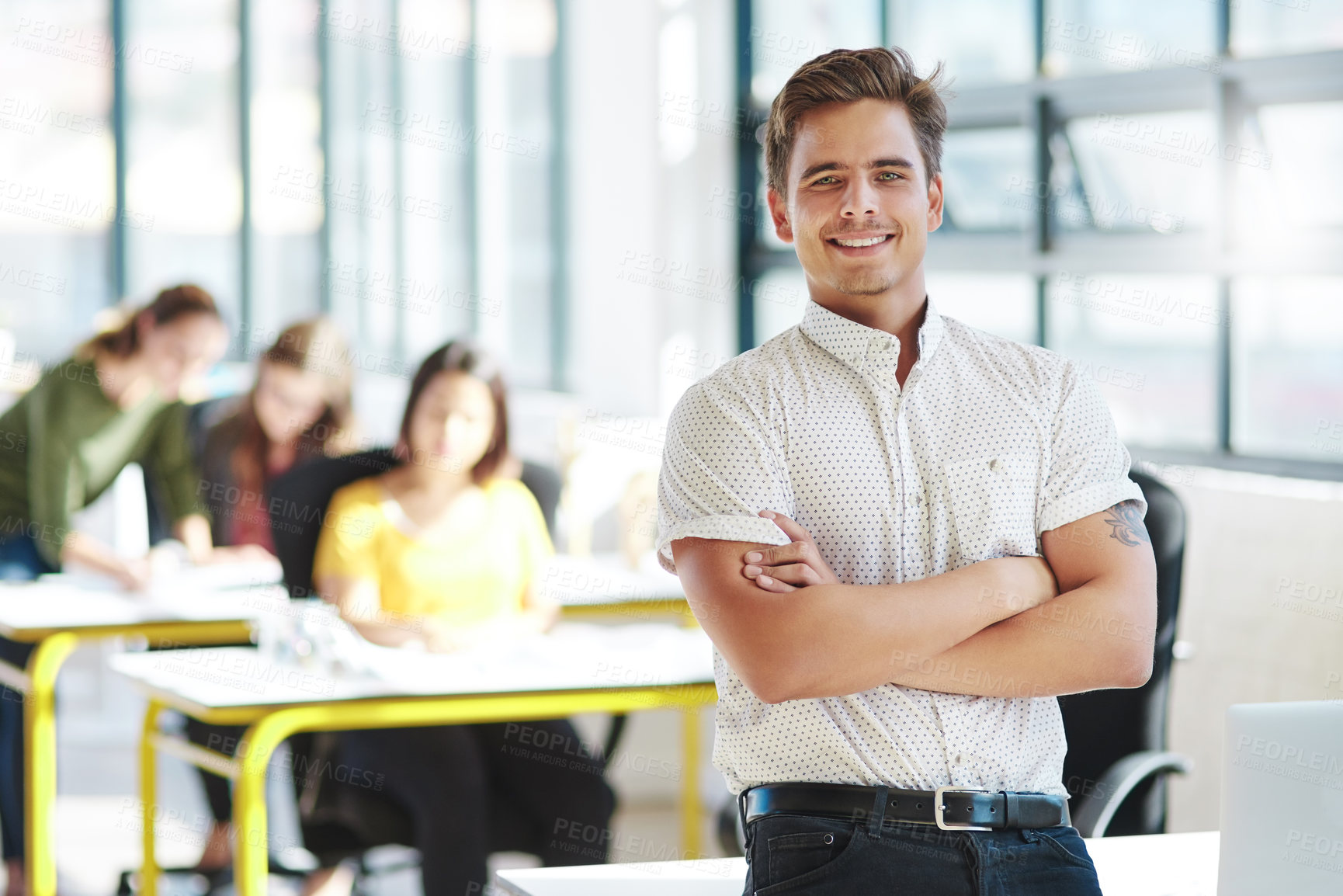 Buy stock photo Cropped portrait of a businessman in an office with his colleagues in the background