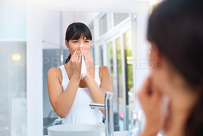 Buy stock photo Asian, woman and allergies in bathroom for healthcare, virus and illness in house for weather change. Sick female person, cough and tissue for sneezing, flu and unhealthy in mirror reflection.