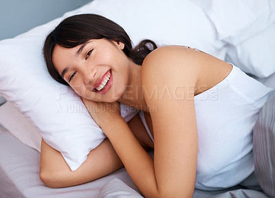 Buy stock photo Woman, happy and comfortably laying in bed for weekend break, peaceful rest and relaxed sleep. Female person, in bedroom and daydreaming for lazy day, fresh bedding or new pillows and duvet 