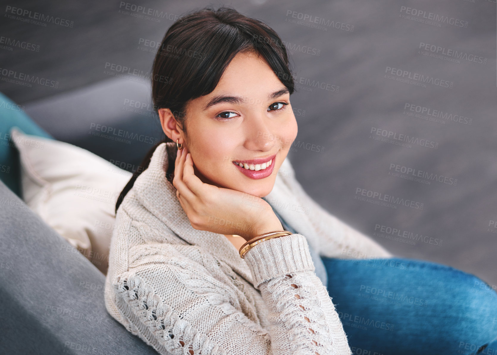 Buy stock photo Beautiful girl, in portrait and smiling on living room sofa for summer break, holiday or relaxing after long day. Woman, happy and sitting on couch in apartment for vacation, comfort or leisure