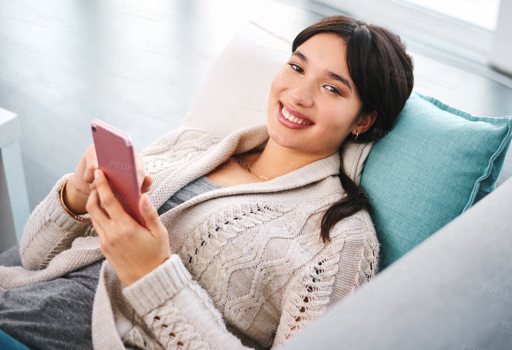 Buy stock photo Asian, gen z and relax with smartphone on sofa for streaming, social media and communication. Networking, email and technology in apartment for connection, conversation and mobile app in house.
